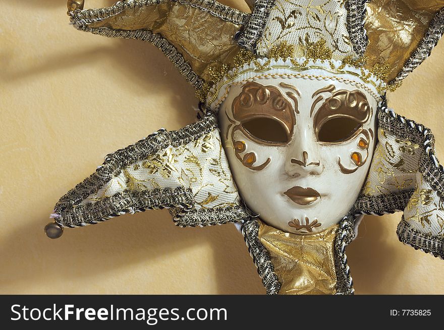 Beautiful Venetian Mask on Light Yellow Wall