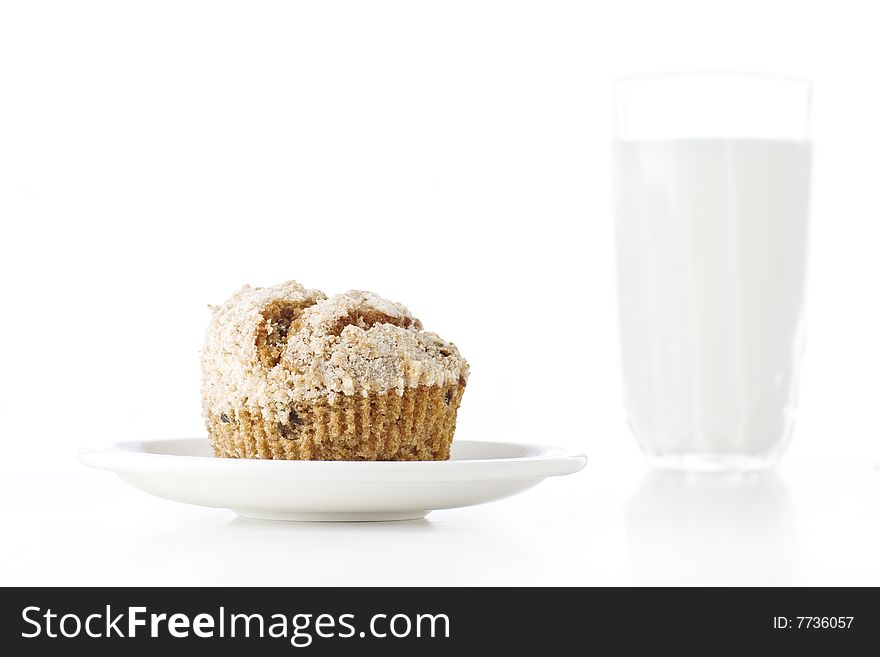 Fresh muffin on white background with glass of milk