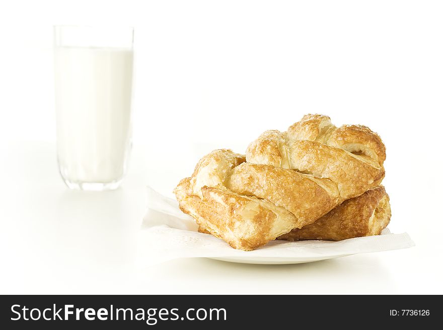 Freshly baked pastry for breakfast with glass of milk. Freshly baked pastry for breakfast with glass of milk