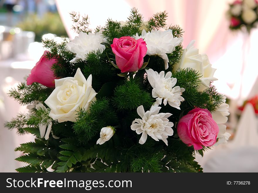 Wedding bouquet with roses on the table