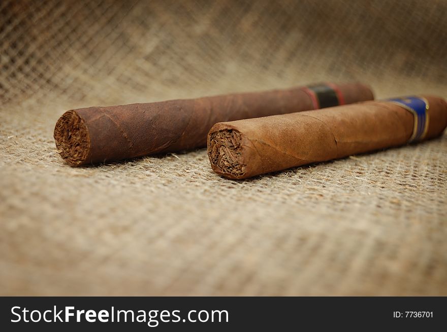 Two Cuban Cigars On Hessian Canvas