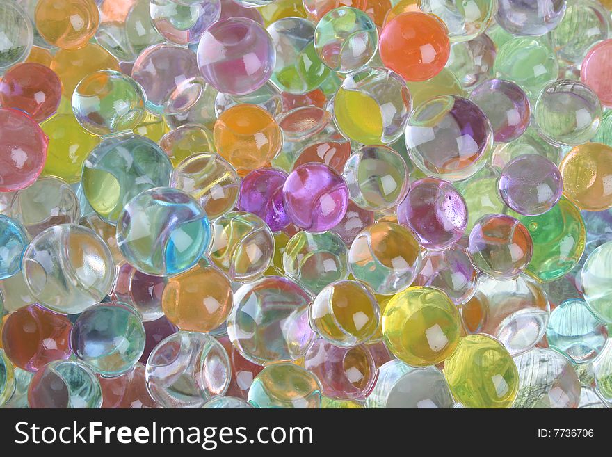 A variety of colored gelatine balls as a background. A variety of colored gelatine balls as a background
