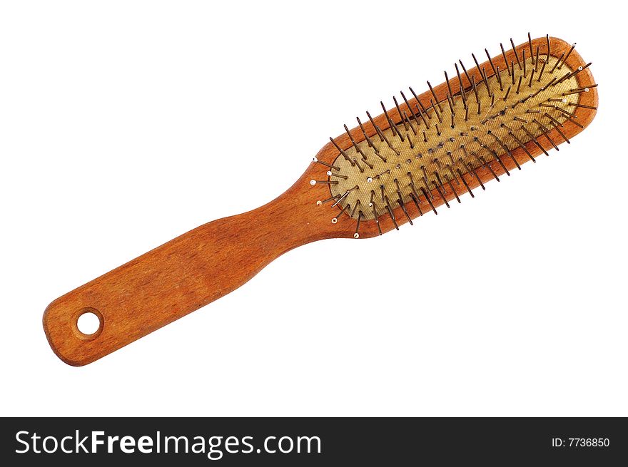 Old comb with wooden handle isolated on the white background. Used and dusty. Old comb with wooden handle isolated on the white background. Used and dusty.