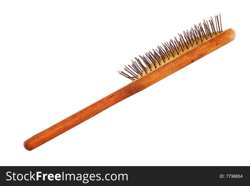 Old comb with wooden handle isolated on the white background. Used and dusty. Old comb with wooden handle isolated on the white background. Used and dusty.