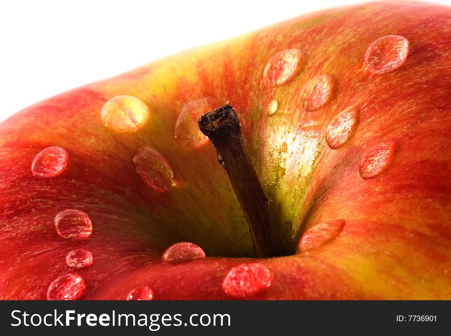 Apple close-up with waterdrops and shallow depth