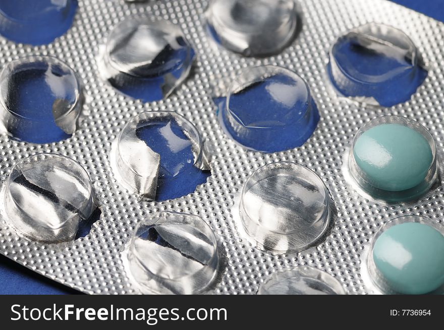 Partially used blue tablets. Close-up. Narrow depth of field. Partially used blue tablets. Close-up. Narrow depth of field.