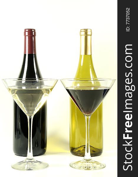Wine glasses and bottles of opposite color. Wine glasses and bottles of opposite color