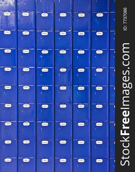 Wall of blue Post Office boxes - portrait interior