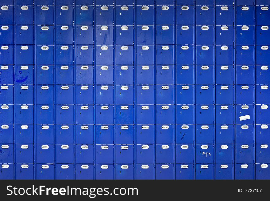 Long wall of blue Post Office boxes - landscape interior