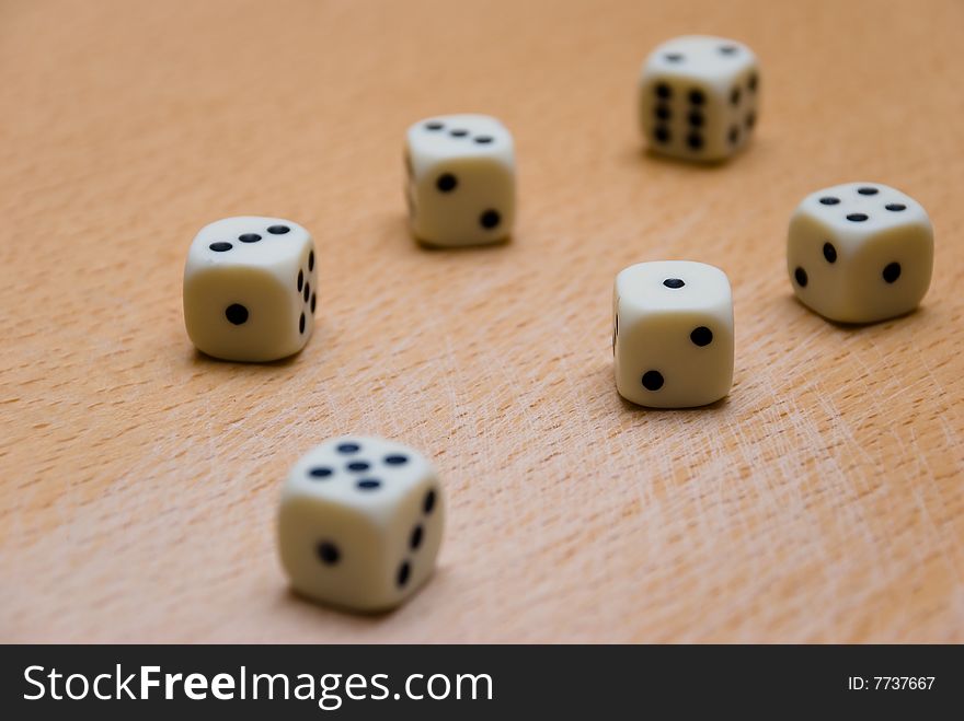 Picture of six dices on a table