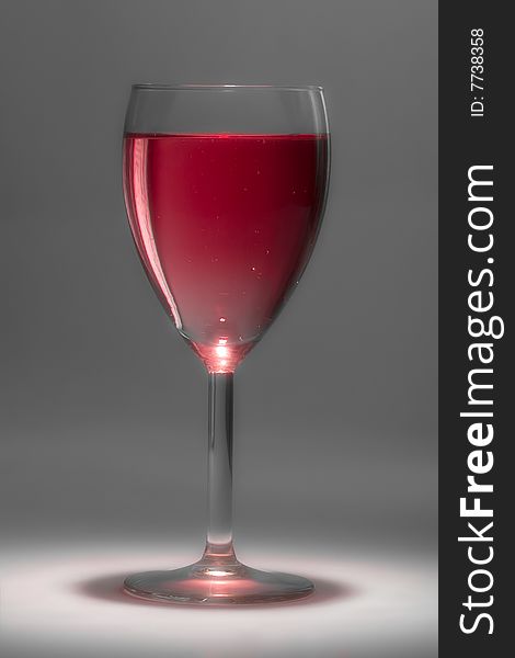 Glass with beautiful sparkling rose wine. Glass with beautiful sparkling rose wine