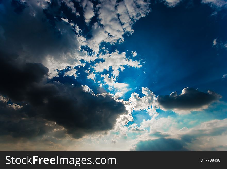 Cloudscape with sun ray shining through.