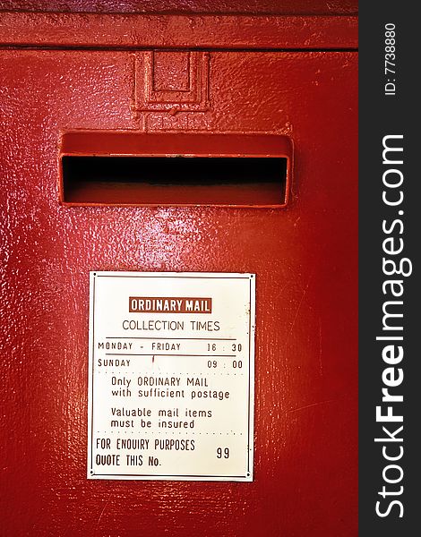 Mouth of red pillar-style post box - portrait exterior