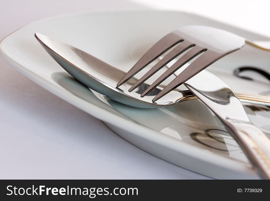 Fork And Spoon On A Plate