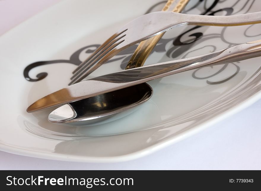 Fork and spoon on a plate