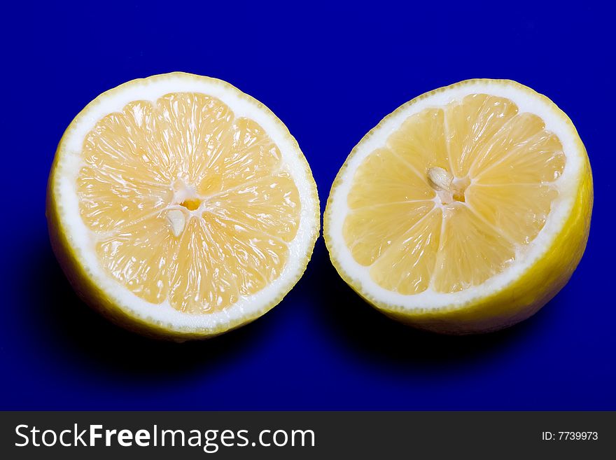 Cuted lemon on blue background