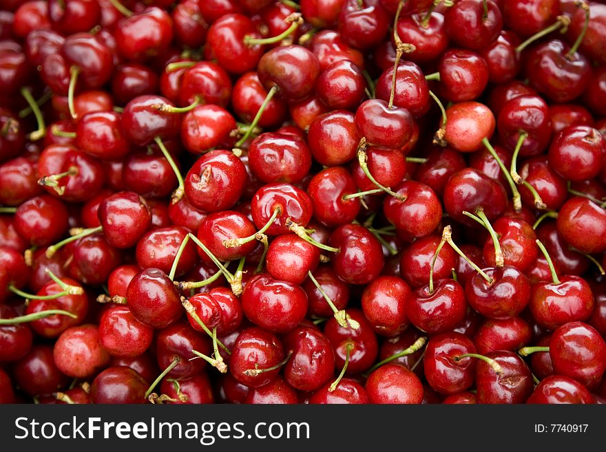 Cluster of Fresh Cherries at a Farmers Market