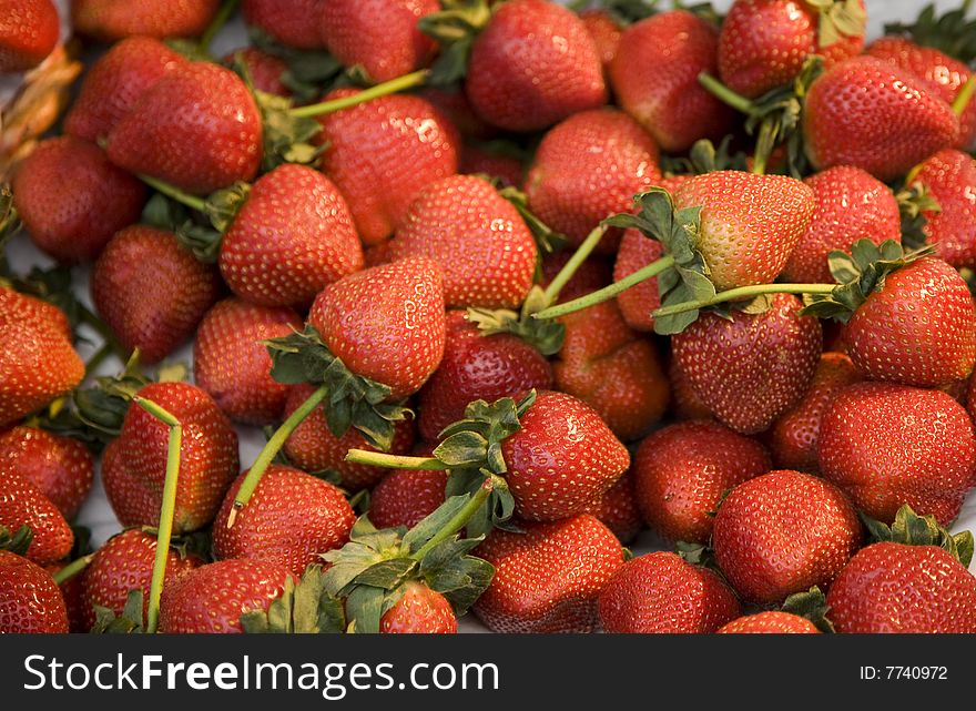 Cluster of Fresh Strawberries at a Farmers Market