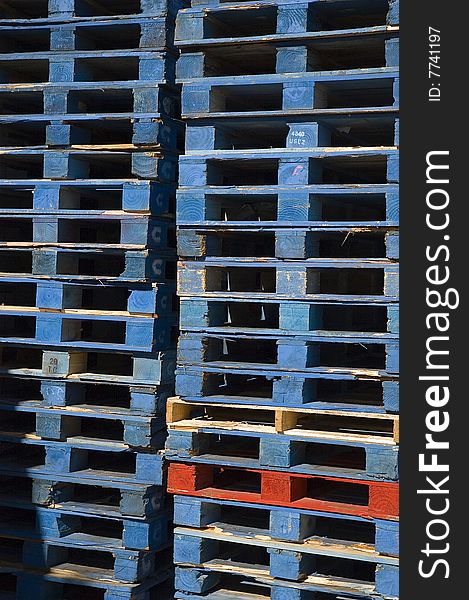 Stacked wooden freight pallets for shipping. Stacked wooden freight pallets for shipping.