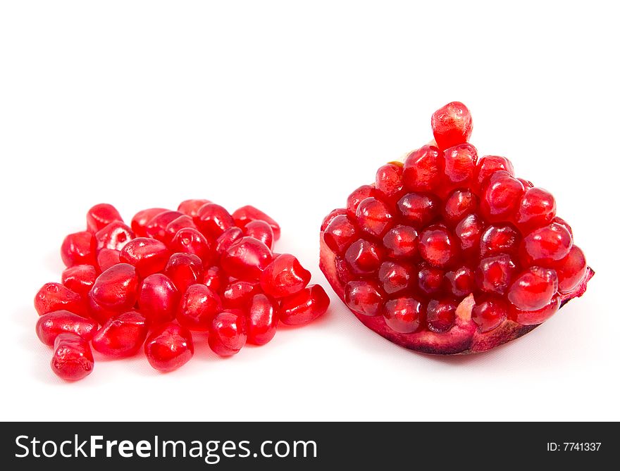 Piece of pomegranate over white background