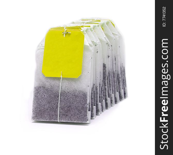 Tea bags, yellow label, isolated image, white background
