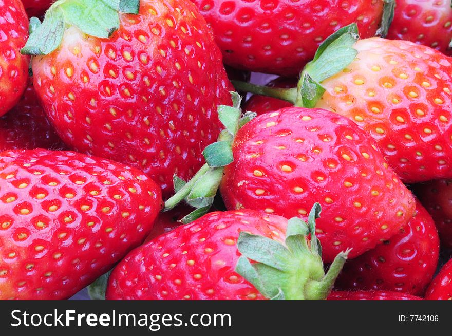 A close up shot of strawberries filling the frame