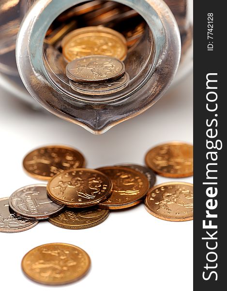 Glass bottle full of coins