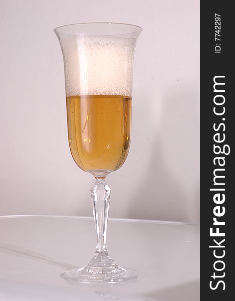 Glass of beer on a white background