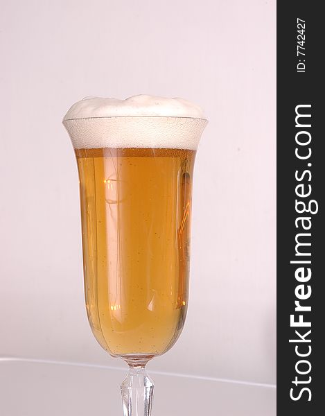 Glass of beer on a white background