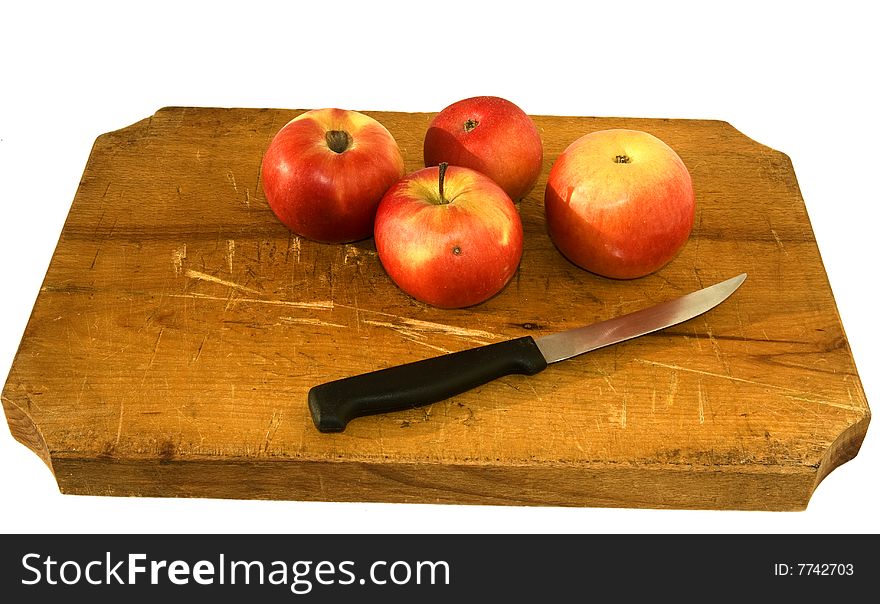 Desk with apples and knife