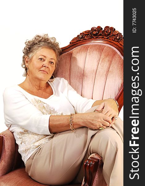 An nice senior woman relaxing in an pink armchair and just dreaming into
the day. Wearing beige trousers and a white sweater. An nice senior woman relaxing in an pink armchair and just dreaming into
the day. Wearing beige trousers and a white sweater.