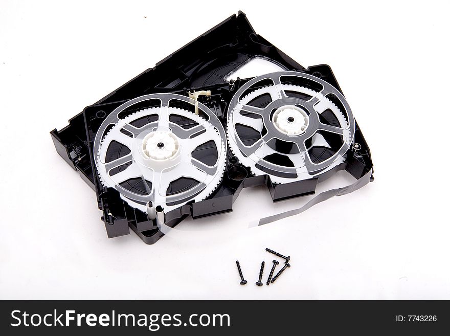 Broken black video cassete on white background. Broken black video cassete on white background