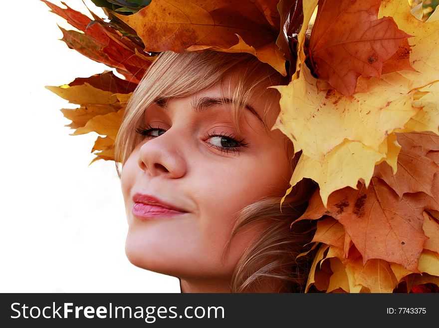 Isolated autumn girl with yellow leaves