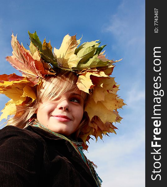 Autumn girl with yellow leaves and blue sky. Autumn girl with yellow leaves and blue sky