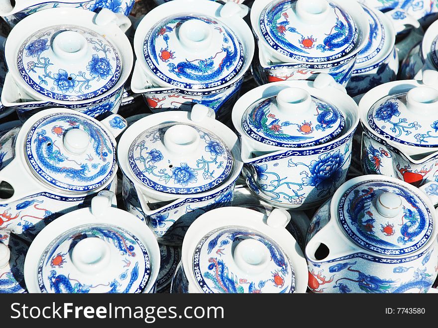 The Chinese porcelain teapots with blue flower patterns.