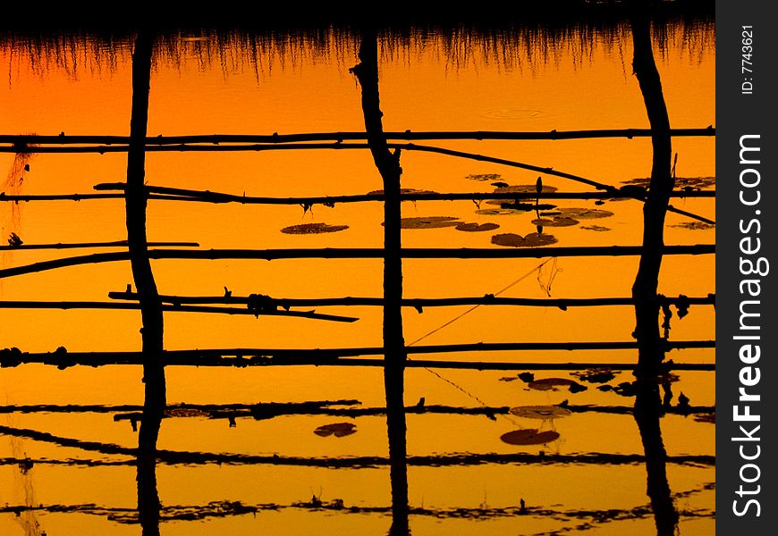 Sunset on a small lake in north cambodian village. Sunset on a small lake in north cambodian village