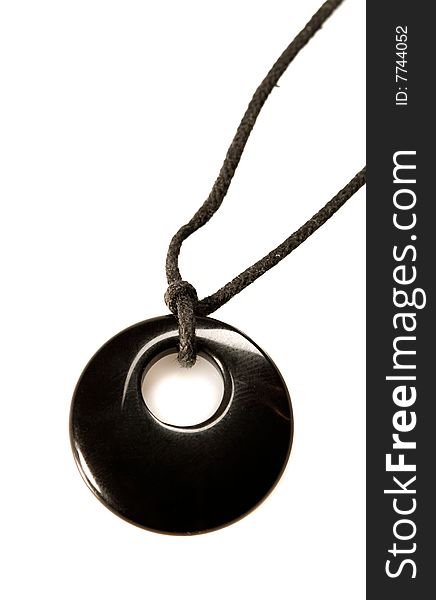 Black onyx pendent on white ground. Black onyx pendent on white ground