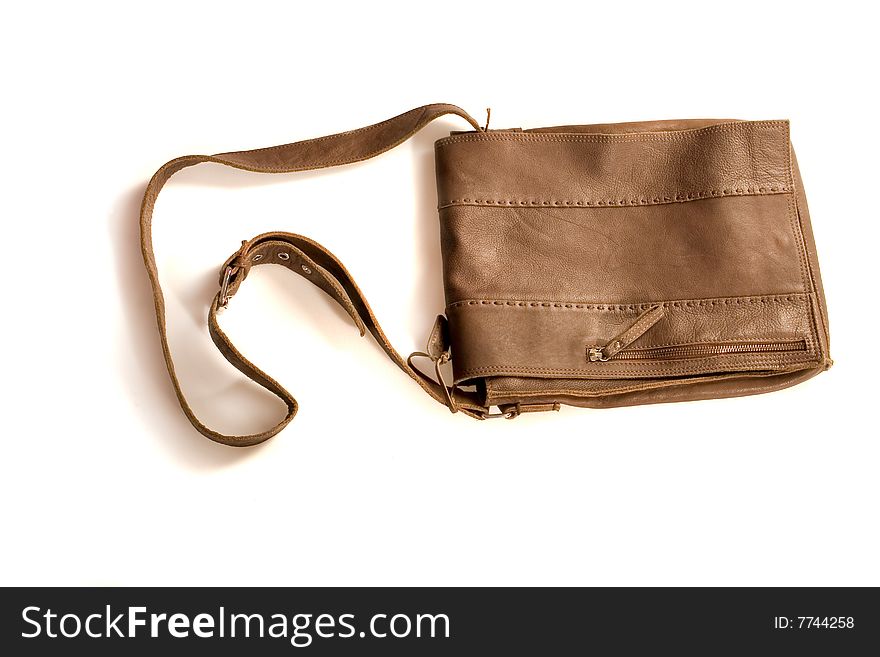 Brown leather bag on white ground