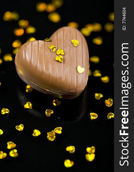 Chocolate heart on black background. Chocolate heart on black background