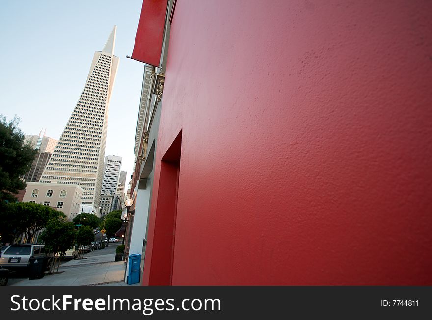 Transamerica Tower next to a red facade. Transamerica Tower next to a red facade.