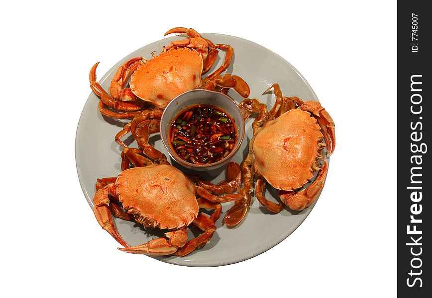 Steamed crabs served with ginger chili dipping sauce. Clipping path embedded. Steamed crabs served with ginger chili dipping sauce. Clipping path embedded.