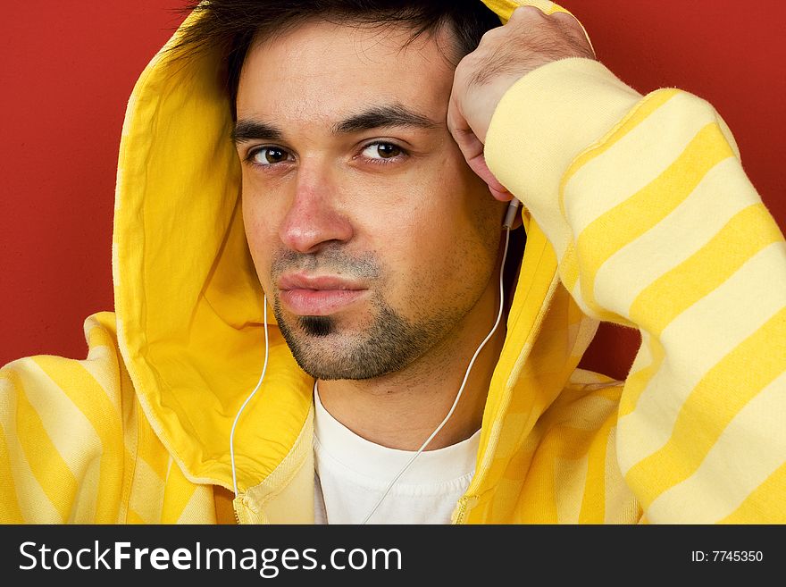 Portrait of Young Man Listening To Music. Portrait of Young Man Listening To Music