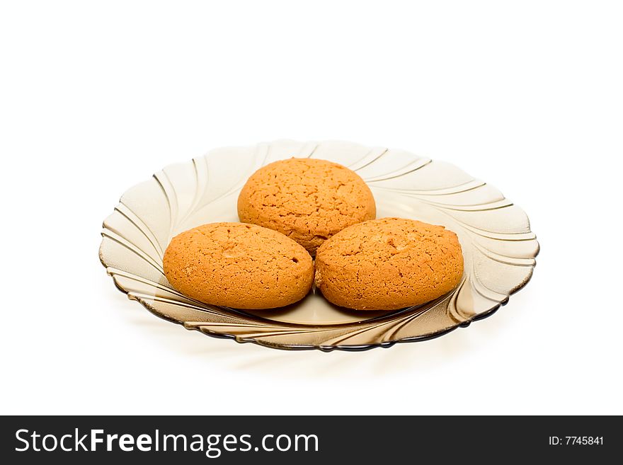 Cakes on plate isolated on white