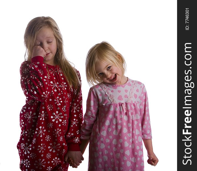 Sleepy sisters in their pajamas and ready for bed