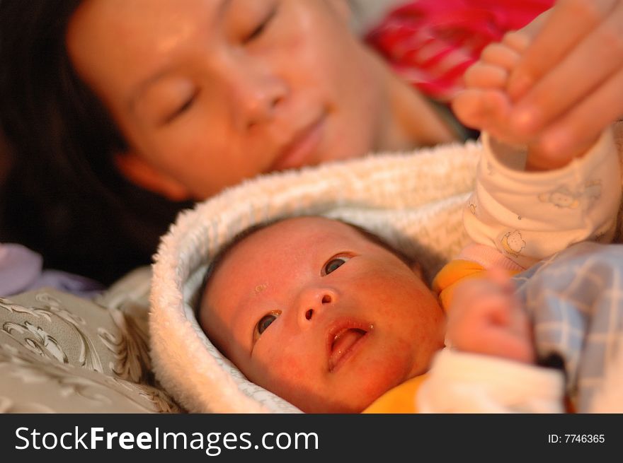 A warm scene of baby and mother.