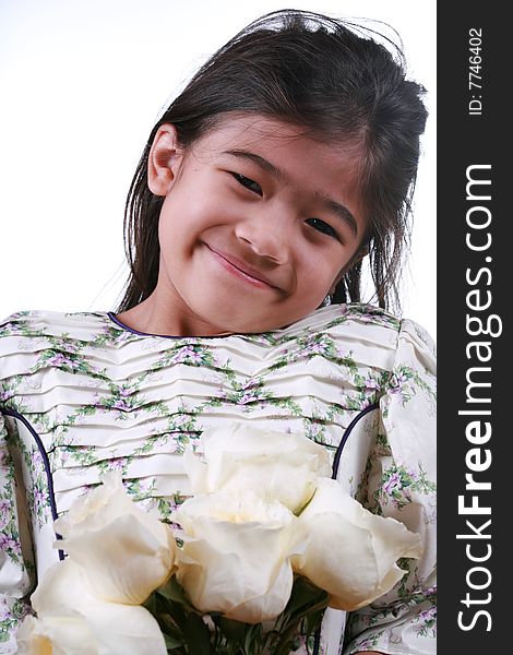 Asian child holding handful of white roses. Asian child holding handful of white roses