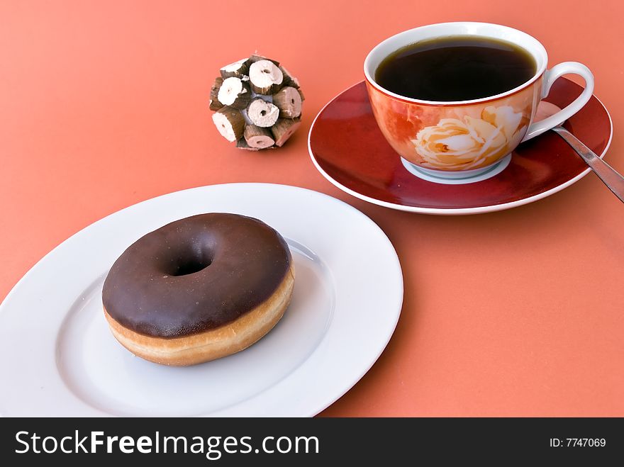 A fresh Coffee with donut.