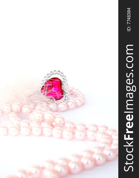 Red heart stone and pink pearls. Red heart stone and pink pearls.