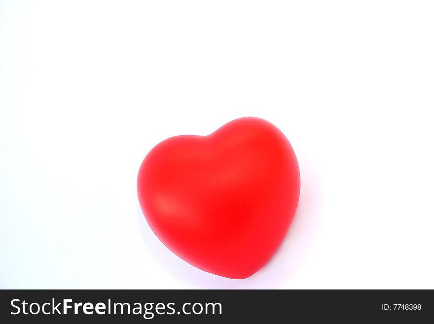 Red valentine heart on white background.