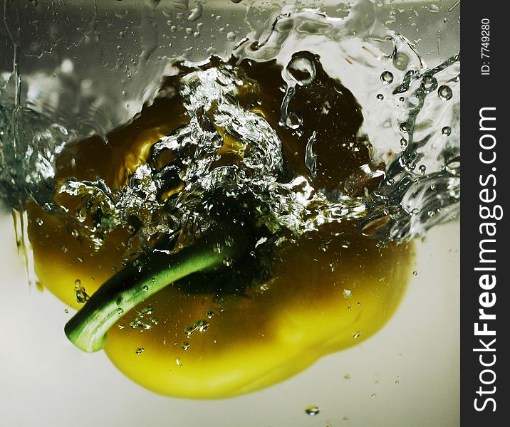 The Bulgarian pepper falling in water. The Bulgarian pepper falling in water